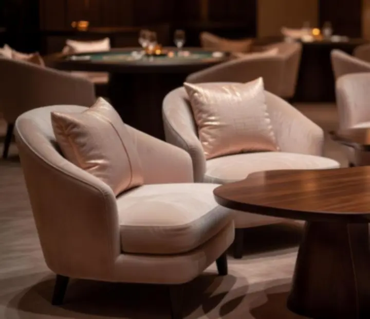 Private lounge with plush seating and warm amber lighting.